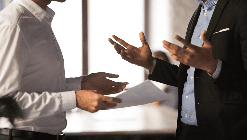 2-men-discussing-document-expressive-hands