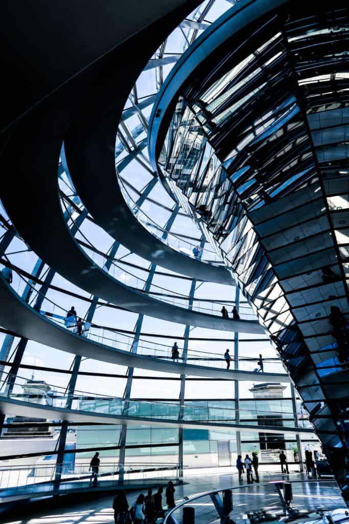 the inside of a glass building looking out